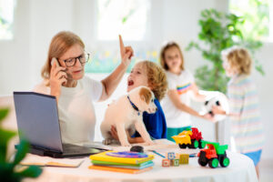 Mom telecommuting in busy house