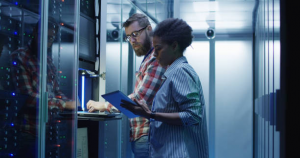 IT Support being given by a Technician in Network Closet