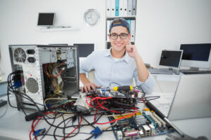 Smiling Computer Technician (Choosing an IT company blog)