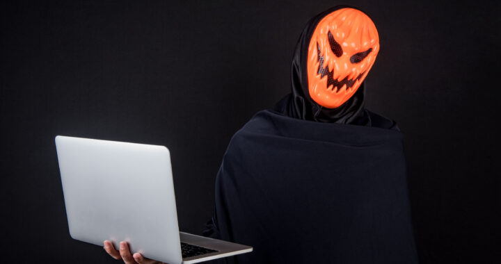 Hacker in pumpkin mask